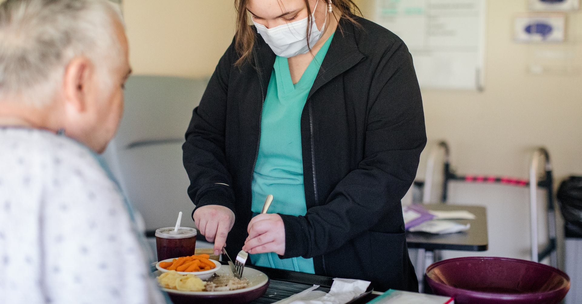 Nurse feeding patient